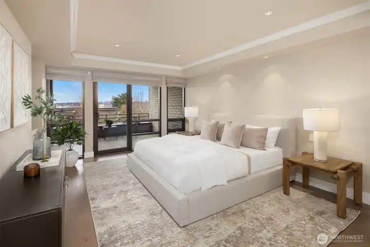 The spacious primary suite offers a spa-like escape with heated floors, a generous marble shower with bench, and refined finishes throughout.