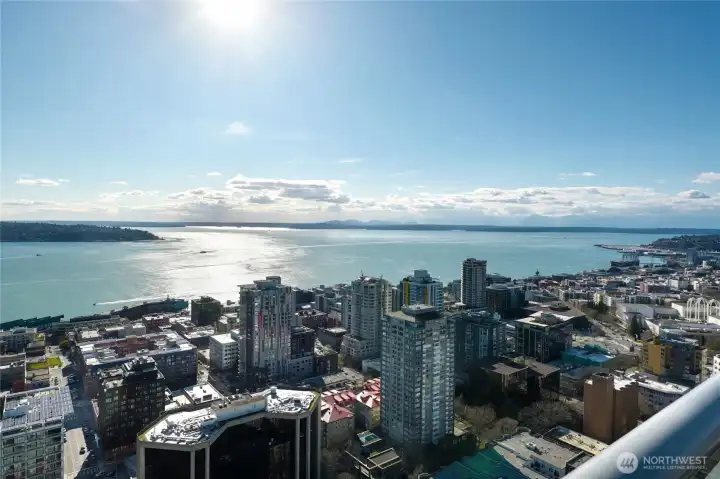 Aerial views of the city, Puget Sound & Olympic Mountains from Insignia Condominium.