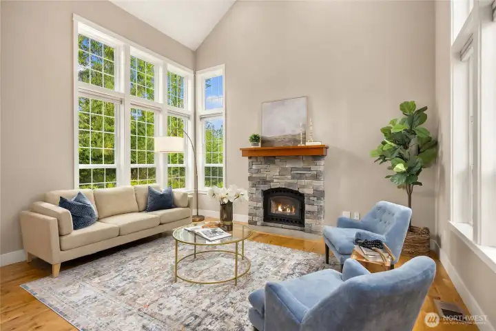 Anchored by the stone surround fireplace, the living room is light and bright.