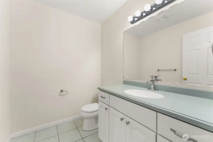 Powder room conveniently located just off the main living area