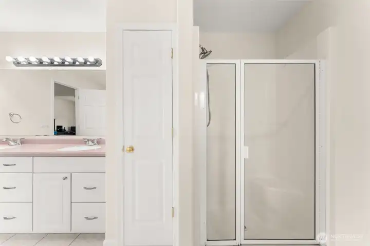 Primary bathroom with built-in storage closet