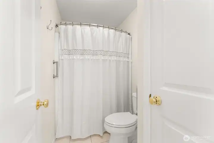 Jack-and-Jill bathroom has a private shower and toilet