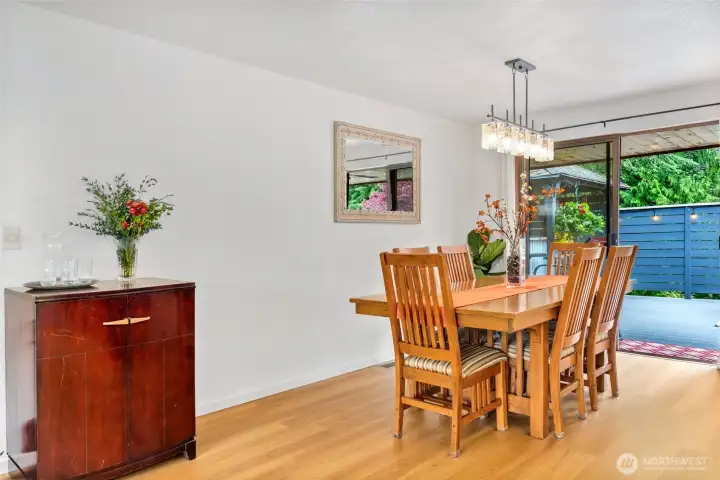 Formal dining area looks out over the backyard