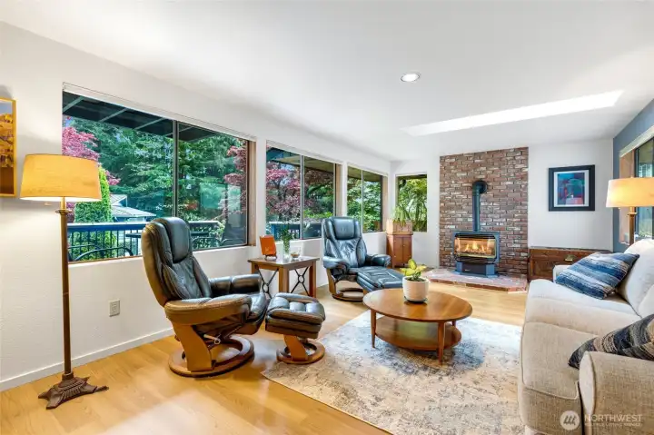 HUGE Family room off of kitchen with windows on both sides for tons of light. Overlooking the lush backyard