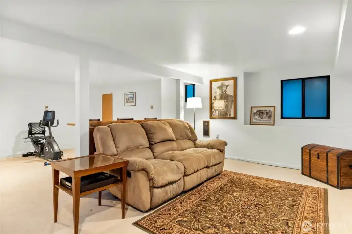 Another view of the bonuse room downstairs. Couch stays with home.