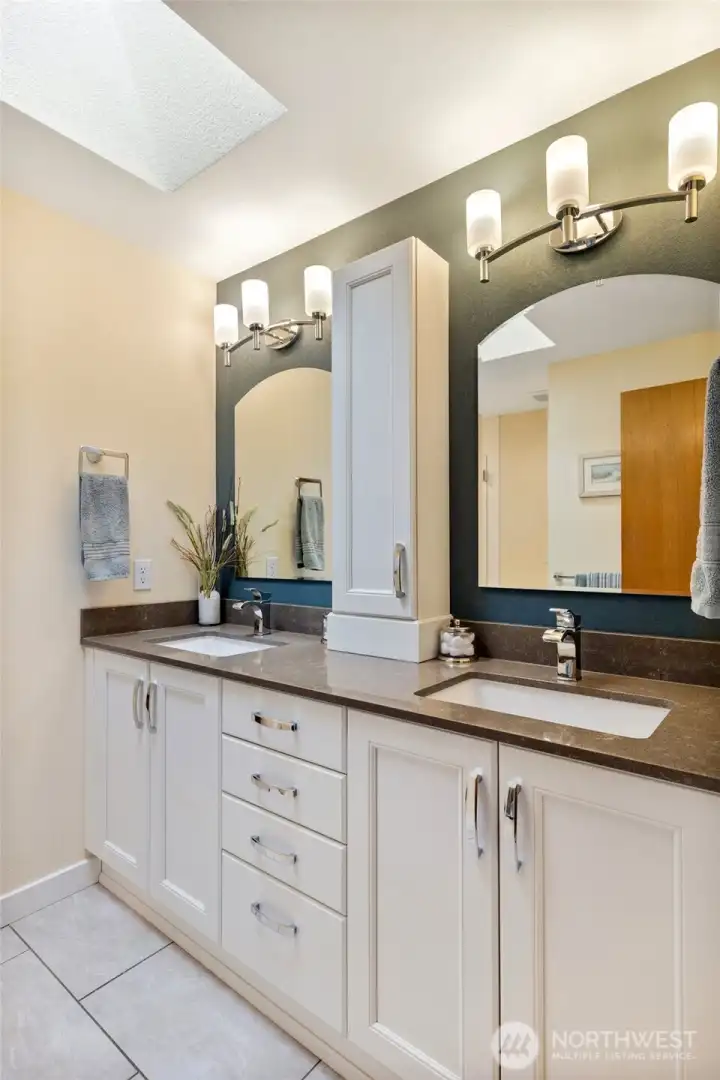 Primary bathroom with heated floors, walk-in shower and walk-in closet