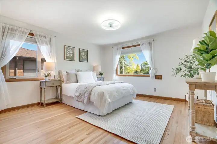 One of two main floor bedrooms. This may serve as the primary bedroom.