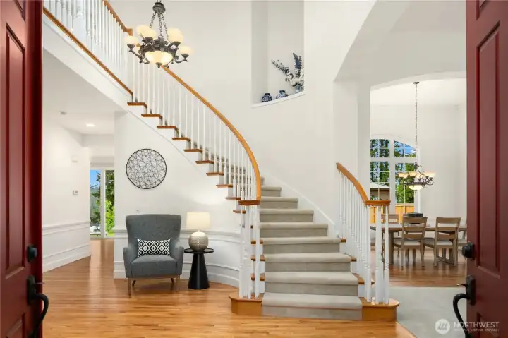 Gleaming oak floors and a grand sweeping staircase with a mammoth art niche greets you as you enter.  Imagine greeting family and friends in this large entry as they arrive for holidays and special occasions.