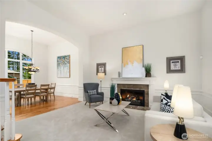 Here's another view of the large living room as it flows into the formal dining room with gorgeous oak floors.