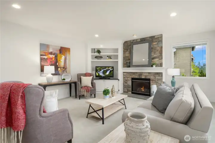 Here's another view of the family room that highlights the many recessed lights that create a warm ambiance.  This room can accommodate plenty of seating for all your gatherings.