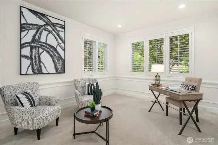 To the left of the entry, through double French doors, is a very private office space in its own separate wing.  It has a closet, and with a 3/4 bath nearby, it can also serve as a main floor bedroom for family or visiting guests.