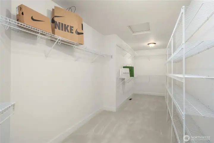 Yes, this photo is accurate!  This is an enormous walk-in closet off the primary bath.  There is plenty of room for a huge wardrobe of clothes, shoes, and accessories with various shelves and hanging racks.
