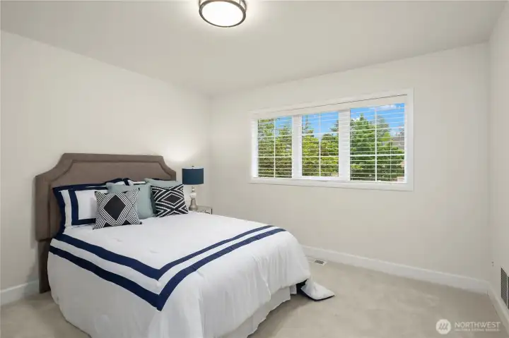 Secondary bedroom has plenty of room for a queen size bed and additional furniture.  This room is brightened by a west facing window.