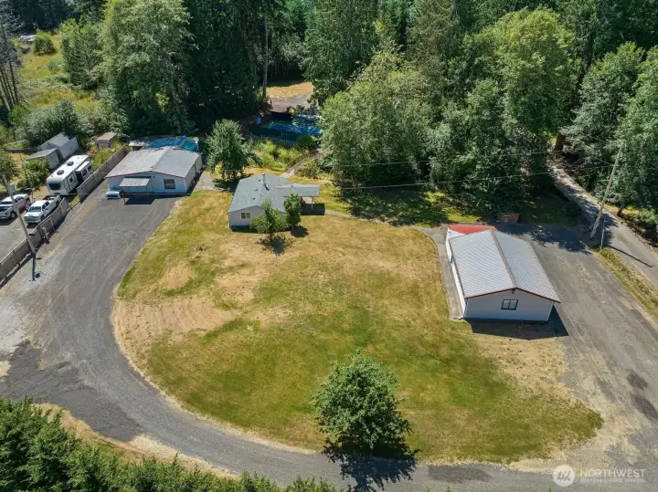 Two shops and and rambler. bridge access to pickleball courts and other side of property. Two shops and and rambler. bridge access to pickleball courts and other side of property.