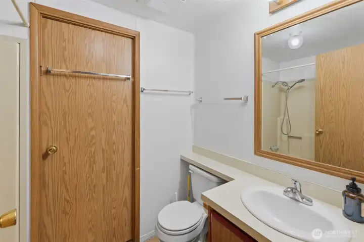 Door to laundry from bathroom