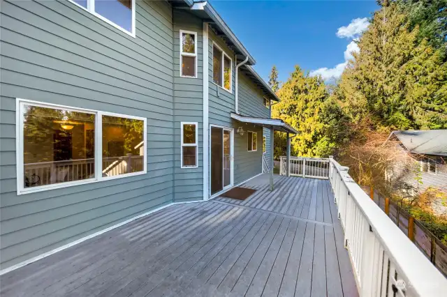 Oversized back deck is approx 12'x30', trex desking and a covered sitting area. Stairs off the north side to access the large yard.