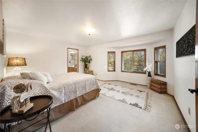 The master bedroom is approximately 15'x13' and features a bay window sitting area. It’s spacious enough to accommodate a king-sized bed and more.