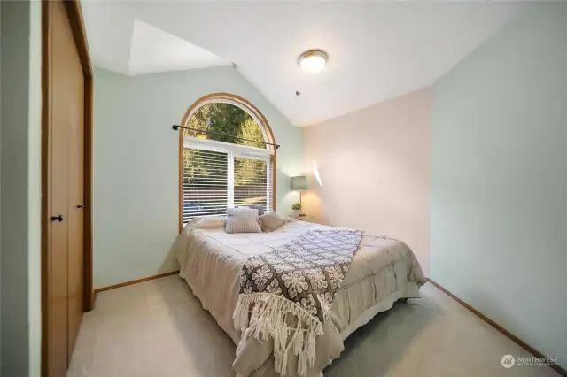 Bedroom 3 features a custom vaulted ceiling, allowing for beautiful late afternoon lighting!