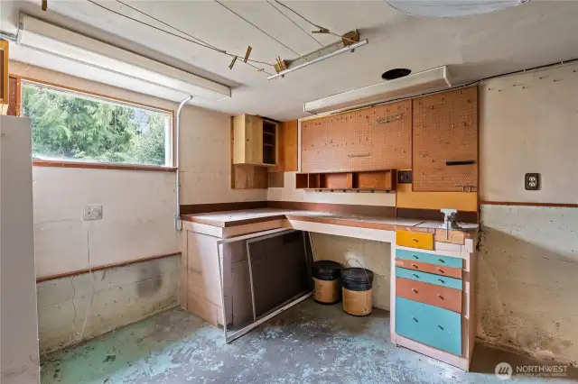 Shop area with work space and cabinets