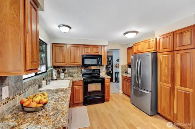 Warm and inviting Kitchen with beautiful cherry cabinets.