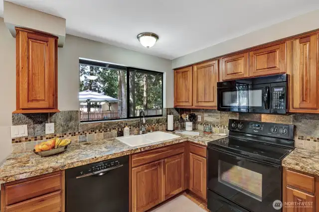 Kitchen with newer counter tops.
