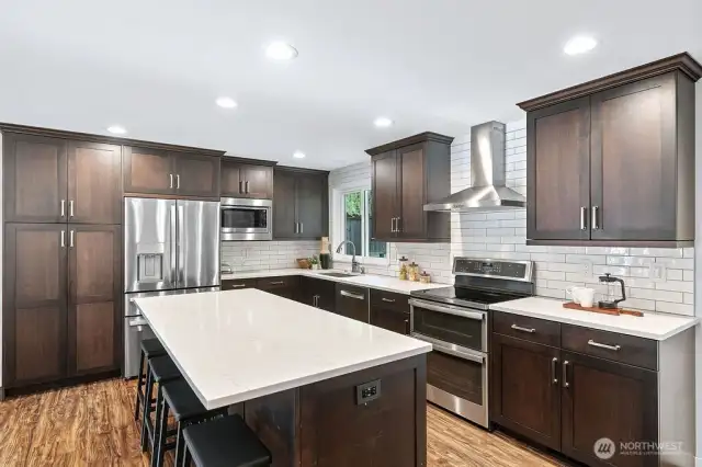 Large kitchen island with bar seating and extra cabinets