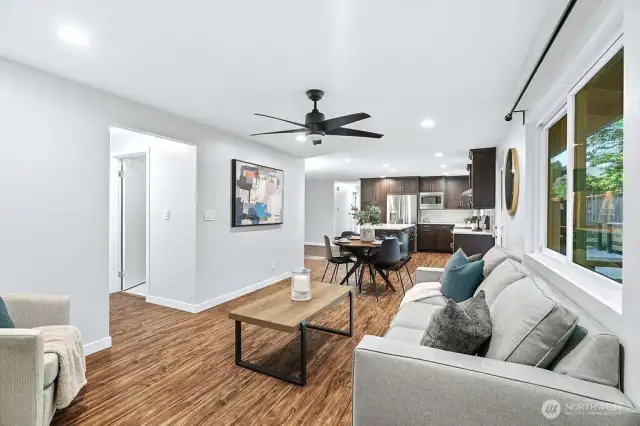 The open concept living area flows seamlessly into the kitchen.