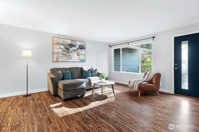 Large front window fills the open space with plenty of natural light.