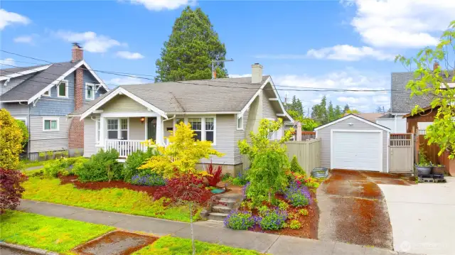 Lush landscaping with a sprinkler system. 3 spots for parking (1 in garage, 2 spots in long driveway)