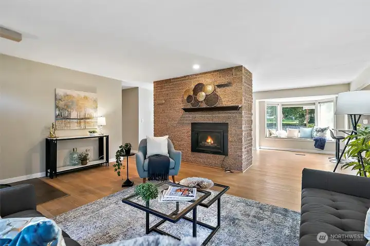 Dual sided fireplace -- living room is gas.   On the other side is the dining room where it is wood!