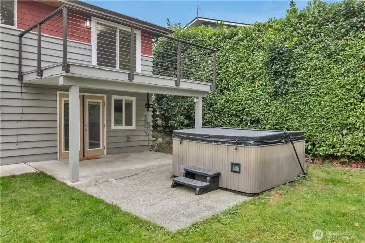 Basement entry and a hot tub to relax in .