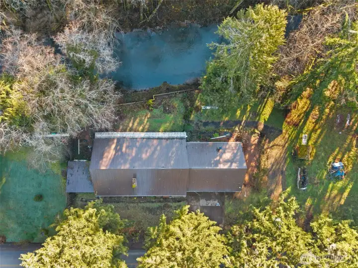 Neighboring property to left, creek at top