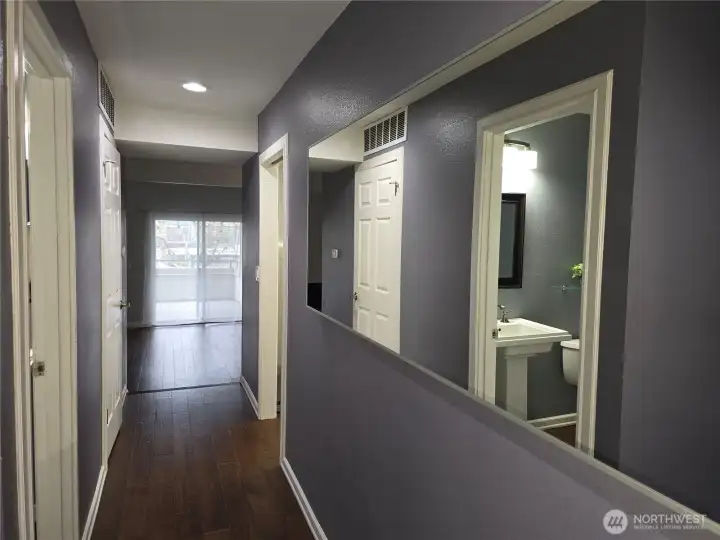 Hall to 1/2 bath, Laundry room, kitchen living areas and second bedroom