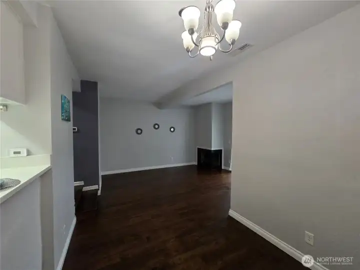 Vuiew from dining into Livingroom with corner fireplace