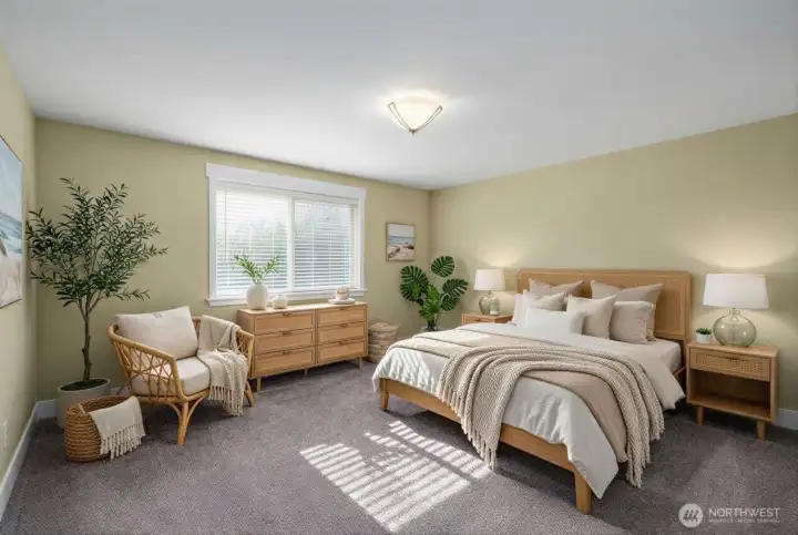 Stunning primary suite with an abundance of space! Natural light floods the space. Your retreat feels tucked away from the main living space and additional bedrooms with en suite bathroom. Fresh paint and new carpeting. Photo is virtually staged.