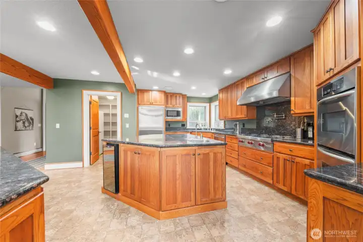 Impressive kitchen with two islands, granite, high end appliances, and plenty of work space!