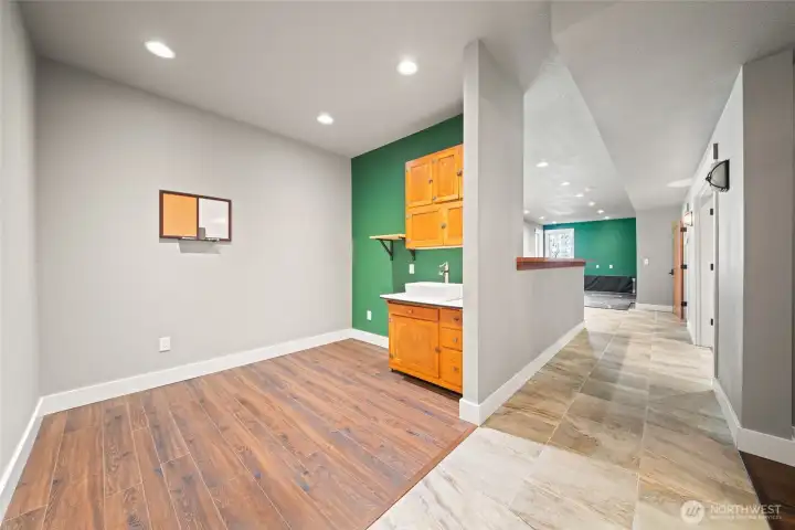 Lower level flex space, could easily be a bedroom with the addition of a door. Has a closet and half bath.