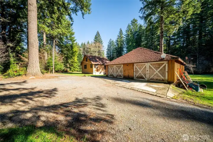 Detached shop building with the cabin.