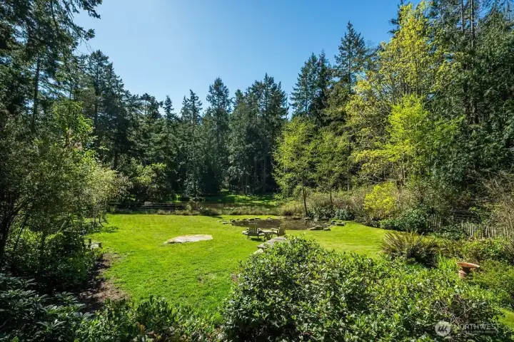 The sunny clearing and buried erratic boulder