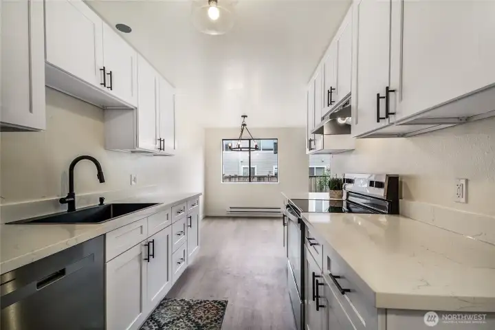 Updated kitchen - white quartz counters, new white cabinets.