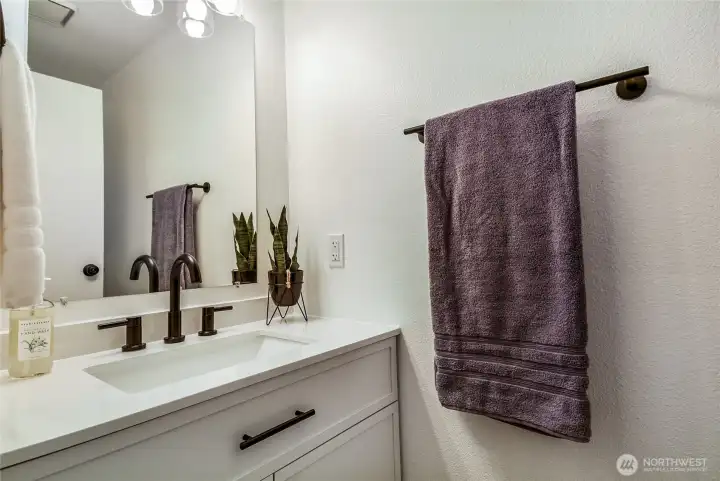 Main floor half bath. Updated vanity with new fixtures.
