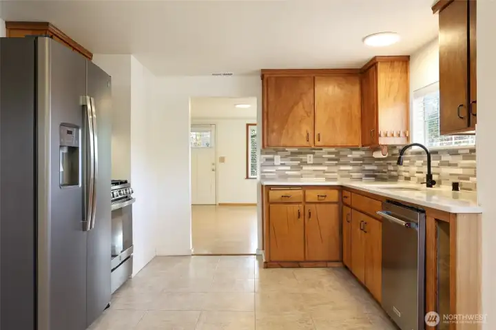 Stainless steel appliances with gas range/oven.