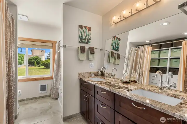 Full bath, storage and heated floors Full bath, storage and heated floors