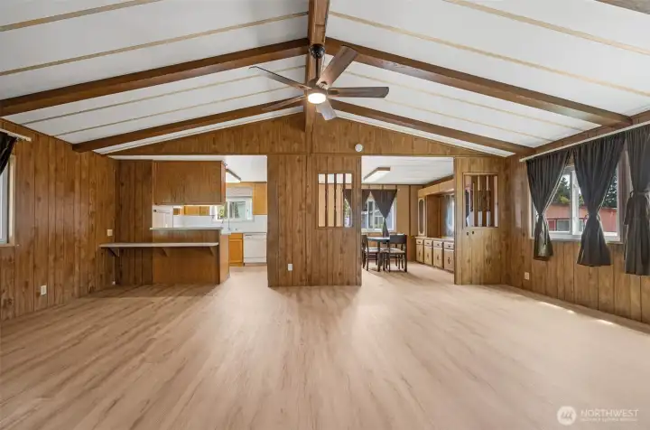 Living rm with view of Kitchen and Dining rm vaulted ceiling has a ceiling fan to circulate the air. Living rm with view of Kitchen and Dining rm vaulted ceiling has a ceiling fan to circulate the air.
