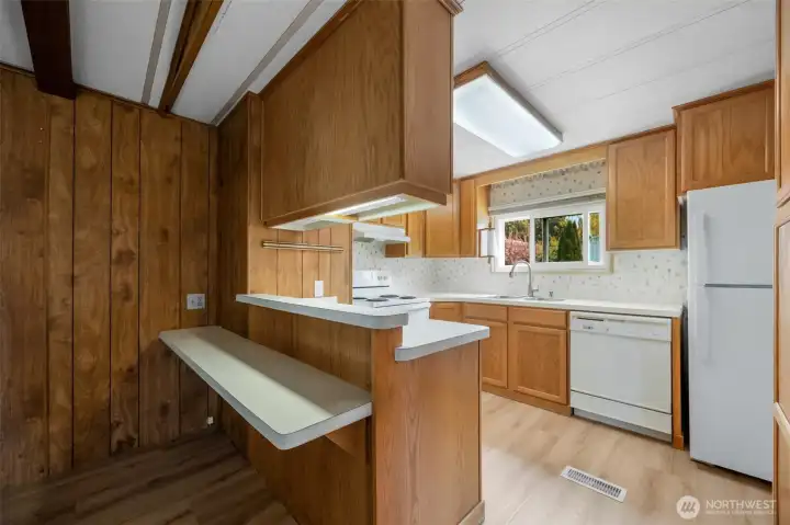 Kitchen with eating bar, forced air electric heat. Kitchen with eating bar, forced air electric heat.