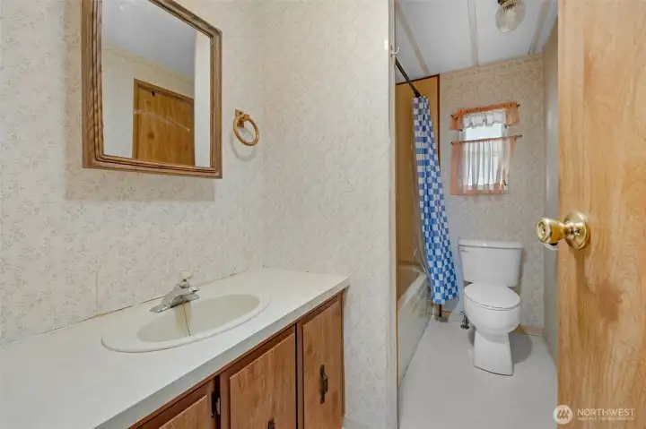 Hall bathroom with tub/shower combo. Hall bathroom with tub/shower combo.