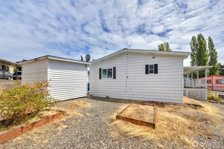 Backyard with shed for storage. Backyard with shed for storage.