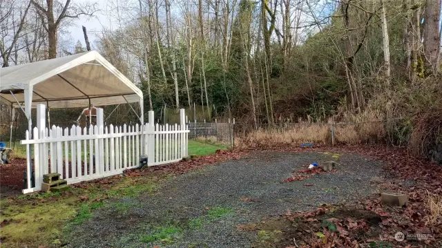 Side with gravel where the owner parking an R.V.