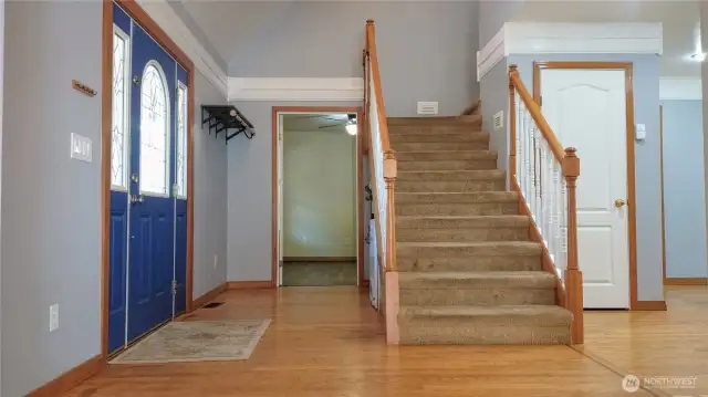 Front entry with coat closet plus coat rack attached to wall.  Under stairs storage and a wall in storage closet unseen to the right.