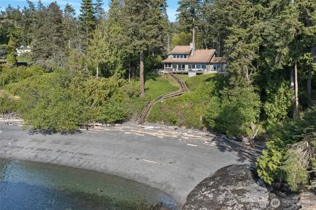 140 Waterfront feet of sand and gravel beach.